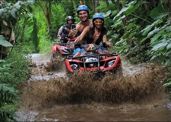 Bali ATV Ride in Ubud Through Tunnel Rice Fields Puddles